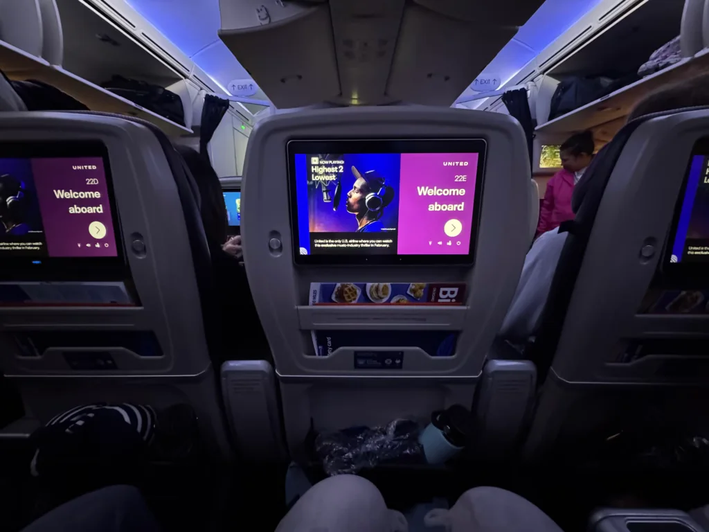 United Premium Plus seatback screen and table from a standard row