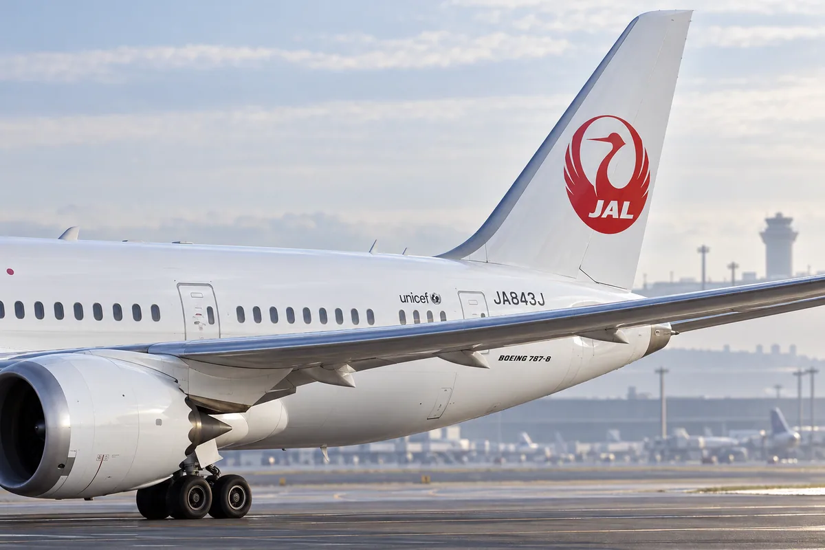 AI-arranged editorial illustration: Japan Airlines Boeing 787-8. Inspired by a related photograph, not the reviewed flight.
