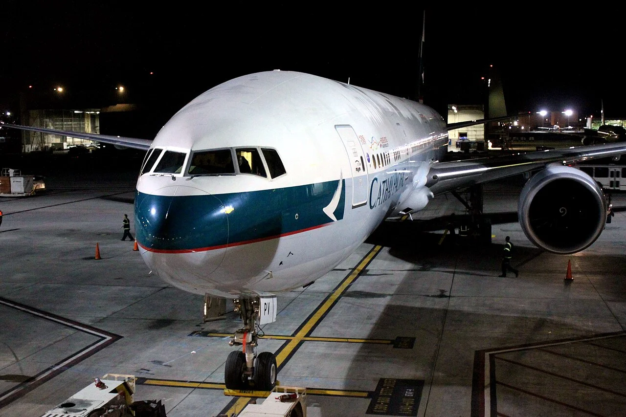 Cathay Pacific Boeing 777-300ER parked at night