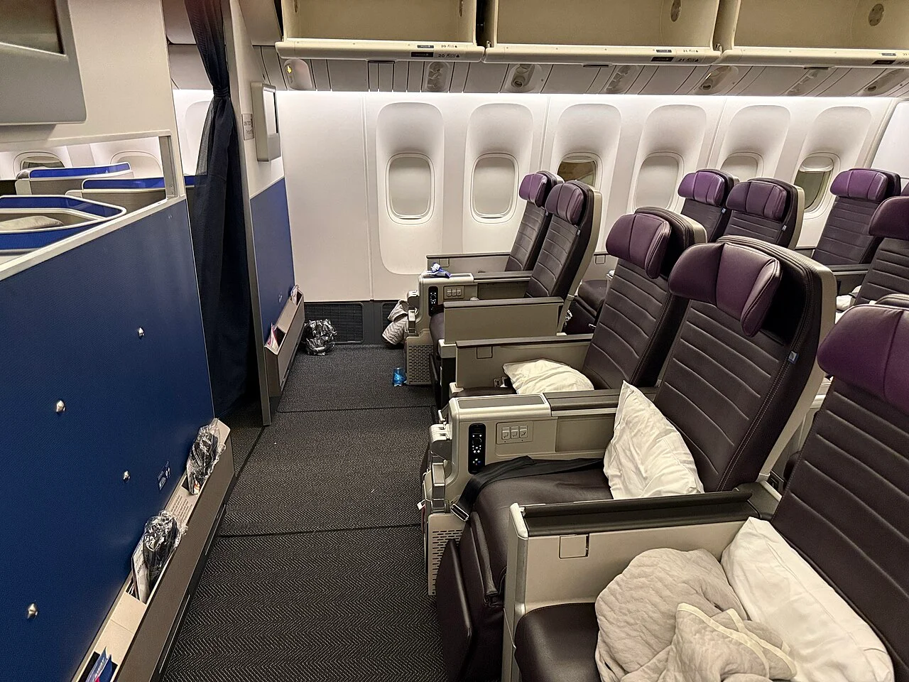 United Airlines Boeing 777-300ER Premium Plus seats; related cabin photograph